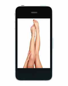 美丽的女腿屏幕黑色的智能手机孤立的