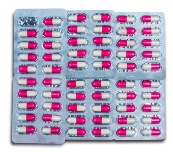 前视图色彩斑斓的抗生素胶囊药片泡包孤立的白色背景全球健康护理药物<strong>合理</strong>的概念粉红抗菌胶囊药片