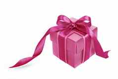 粉红色的礼物盒子粉红色的丝带白色背景
