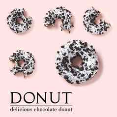 有创意的作文甜甜圈粉红色的背景平躺美味的咬巧克力甜甜圈简单的文本