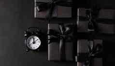 礼物盒子包装黑色的纸黑色的弓丝带黑色的