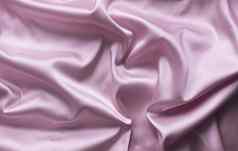 光滑的优雅的粉红色的丝绸软折叠背景
