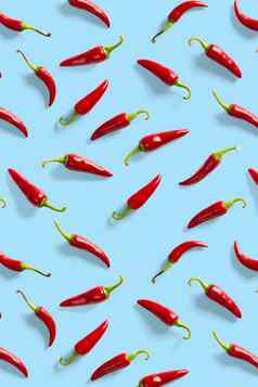 有创意的背景使红色的辣椒辣椒蓝色的背景最小的食物背景红色的热辣椒辣椒背景