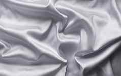 光滑的优雅的灰色的丝绸软折叠背景