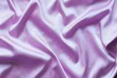 光滑的优雅的淡紫色丝绸软折叠背景