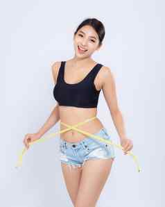 美丽的肖像亚洲女人饮食苗条的测量腰重量孤立的白色背景女孩脂肪团卡路里损失磁带测量健康健康概念