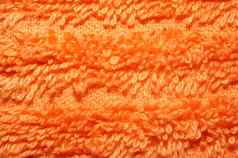 纹理明亮的橙色特里毛巾特写镜头