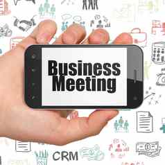 业务概念手持有智能手机业务会议显示