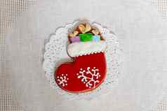 圣诞节姜饼袜子礼物背景餐巾圣诞节长袜姜饼饼干装饰糖衣一年概念
