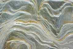 纹理湿海石头污渍让人联想到波