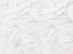 白色丝绸织物优雅的背景柔和的彩色的折叠纺织舒适的静物背景
