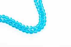 美丽的光蓝色的玻璃闪耀水晶isoalted珠子白色背景Diy珠宝
