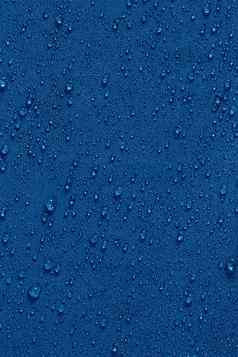 经典蓝色的颜色防水疏水平布特写镜头雨滴背景
