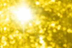 美丽的闪闪发光的黄色的黄金背景照明黄金黄色的散景效果图片黄色的黄金闪闪发光的背景