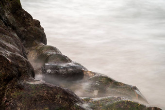 数码单反相机相机石头海滩湿水海波