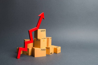 桩纸板盒子红色的箭头增长率生产货物<strong>产品</strong>增加经济指标增加消费者<strong>需求</strong>增加出口进口销售上升