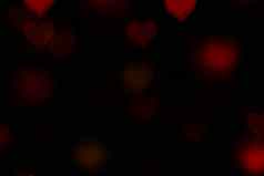 情人节红色的心形的黑色的背景色彩斑斓的照明散景装饰晚上背景壁纸模糊情人节爱背景照明心形状的软晚上摘要