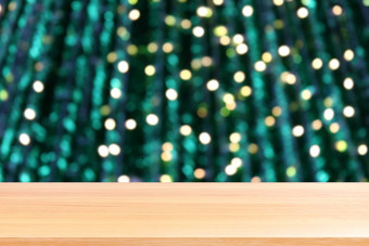 木<strong>板材</strong>照明模糊圣诞节树装饰背景空木表格地板照明绿色圣诞节散景木表格董事会空前面绿色闪闪发光的背景光色彩斑斓的