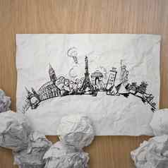 皱巴巴的纸手画旅行世界吸引