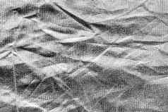 纹理银皱巴巴的织物布摘要背景设计复制空间