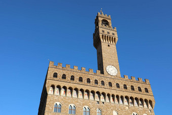 宫殿旧城市大厅宫广场的signoria广场弗洛伦斯意大利著名的历史建筑贝尔塔时钟蓝色的天空背景