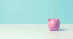 陶瓷粉红色的小猪银行蓝色的背景概念增加收入银行账户储蓄复制空间