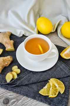 姜热免疫力提高维生素自然喝柑橘类柠檬肉桂茴香乡村风格木背景洋甘菊茶