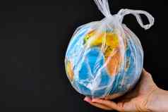 球形式全球塑料袋概念塑料污染地球世界环境一天概念玩具世界全球白色塑料袋