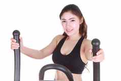 年轻的女人练习锻炼机