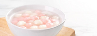 唐元<strong>汤圆</strong>美味的红色的白色大米饺子球小碗亚洲传统的节日食物中国人冬天冬至节日关闭