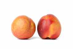 成熟的轮红色的高丽油桃孤立的白色背景美味的健康的水果关闭