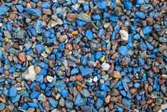 关闭视图蓝色的鹅卵石石头砾石地面纹理高决议