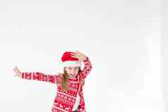 可爱的有趣的圣诞老人的助手跳舞白色背景圣诞节假期概念一年庆祝活动有趣的婴儿圣诞老人美丽的女孩穿红色的圣诞老人他庆祝圣诞节一天有趣的