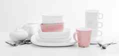 白色粉红色的盘子糖碗杯子光背景