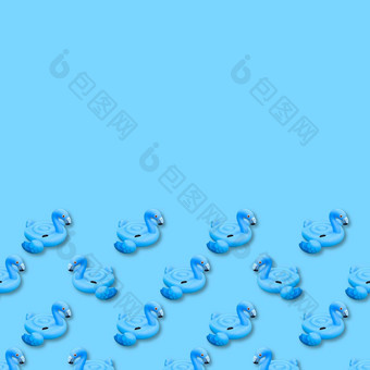 蓝色的火烈鸟单色背景游泳池玩具形状蓝色的火烈鸟无缝的模式火烈鸟充气减少前视图平躺