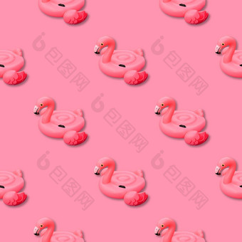 粉红色的火烈鸟单色背景游泳池玩具形状粉红色的火烈鸟无缝的模式火烈鸟充气减少前视图平躺