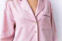特写镜头女人穿着美丽的粉红色的睡衣摆姿势生活房间舒适的睡衣裤首页放松女时尚概念