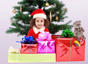 女孩圣诞节树包围礼物