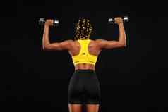 非洲美国女人运动员健美运动员肌肉发达的年轻的健身体育女人锻炼哑铃健身健身房
