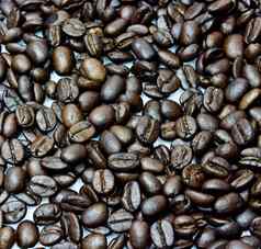 黑色的咖啡豆子特写镜头咖啡豆子背景