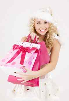 圣诞老人助手粉红色的购物袋