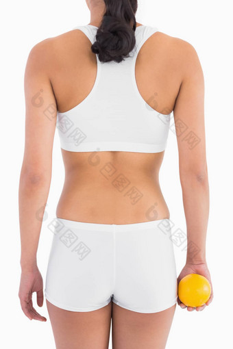 女纤细的身体白色体育<strong>运动内衣</strong>持有橙色