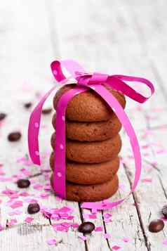 饼干系粉红色的丝带五彩纸屑咖啡豆子