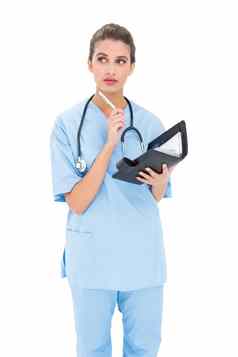 深思熟虑的棕色（的）头发的护士蓝色的实习医生风云持有议程
