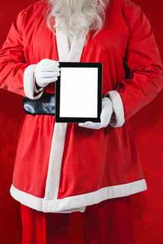 复合图像上腹部圣诞老人老人显示数字平板电脑