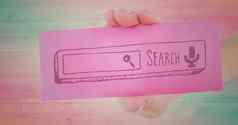 手粉红色的卡显示粉红色的搜索酒吧木面板