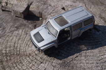 银玩具车木背景吉普车越野车运动型多功能车使金属
