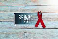 世界健康一天艾滋病意识标志红色的丝带战斗对