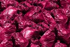 塑料浪费背景垃圾转储本垃圾垃圾垃圾塑料袋桩垃圾袋粉红色的紫色的