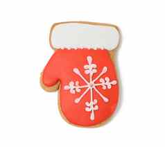 手套形状的烤圣诞节饼干红色的糖糖衣孤立的白色背景
